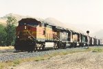Grain train rolls west through the curve